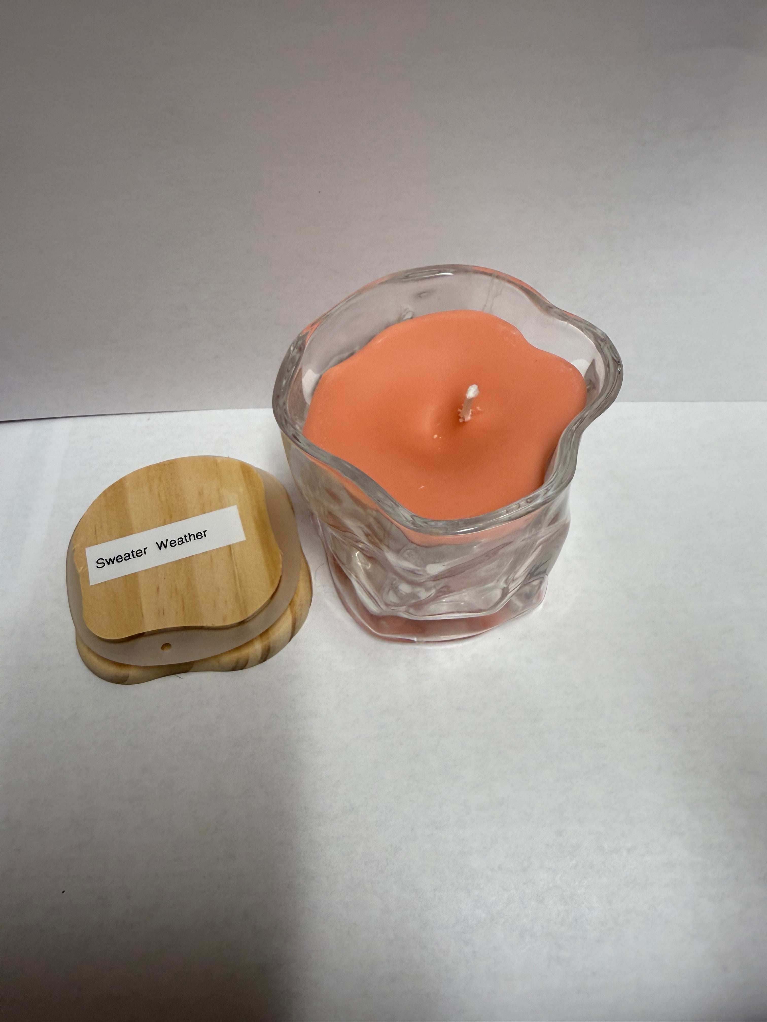 Twisted glass jar filled with soy candle scent of your choice.