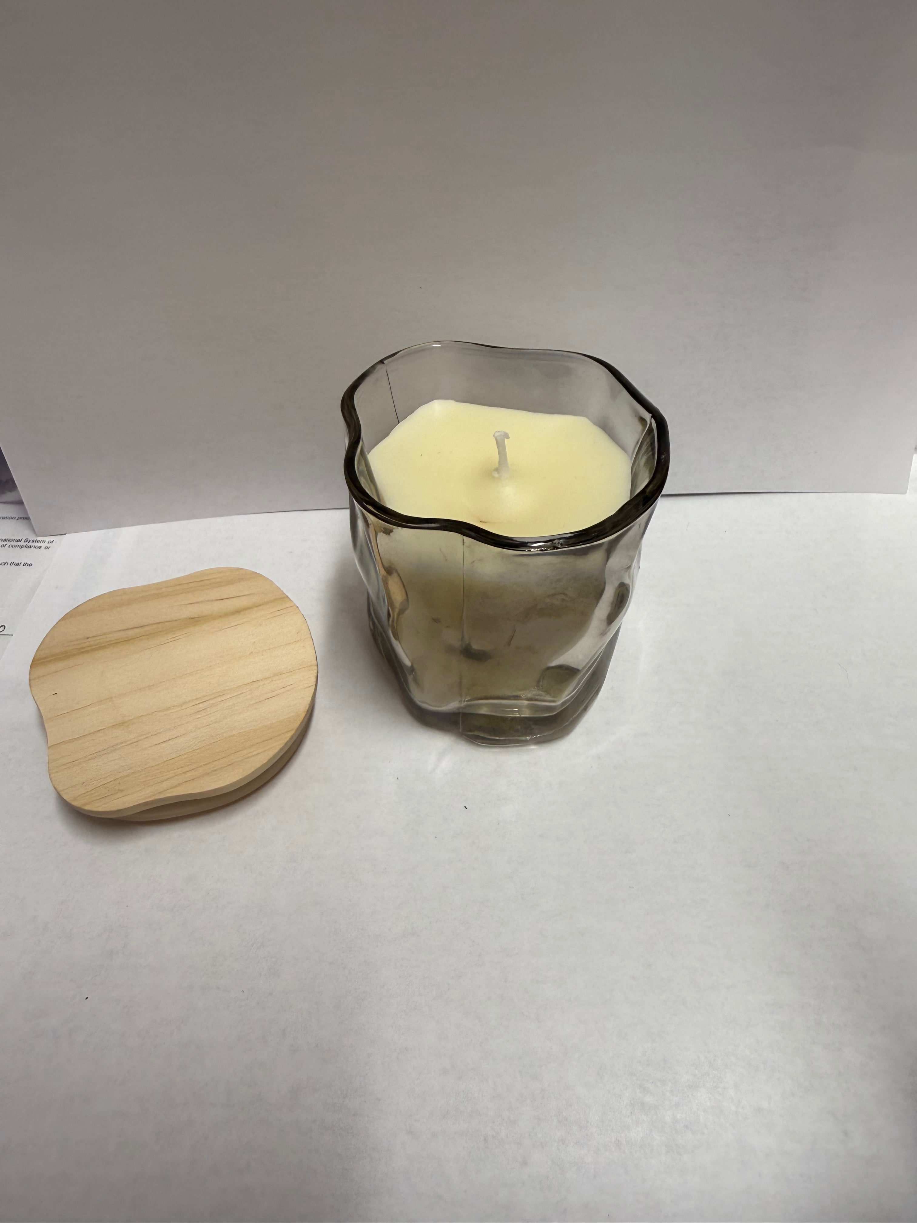 Twisted glass jar filled with soy candle scent of your choice.