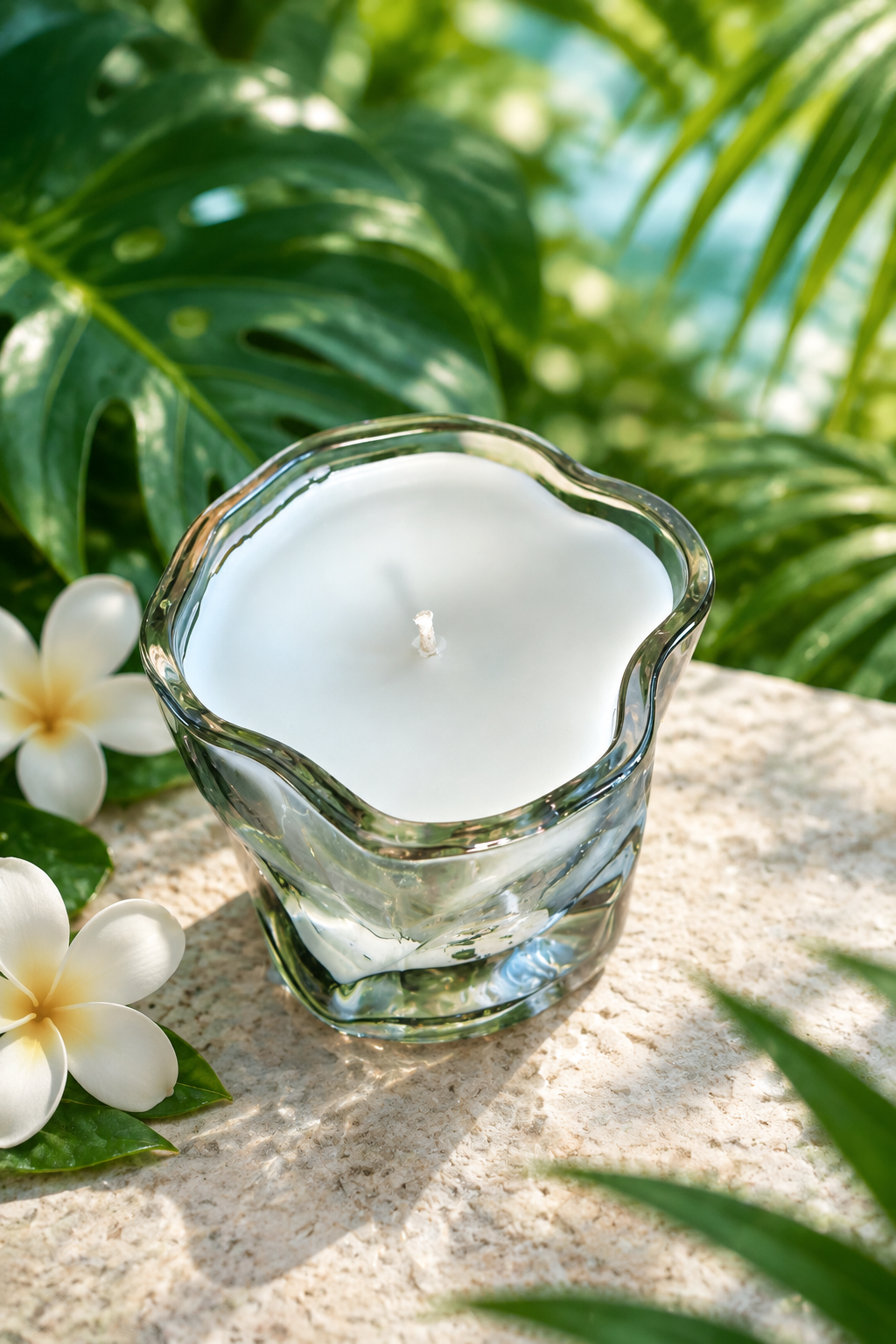 Candle in a lush tropical garden